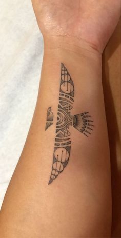 a person with a tattoo on their arm that has an airplane in the middle of it