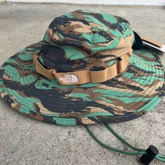 Nwt The North Face Class V Brimmer Bucket Hat In Grass Camo Print - Size - S/M Floppy Bucket Hat By The North Face Fitted With An Adjustable Drawcord. - Nylon - Spot Clean - Imported Casual The North Face Hats For Hiking, Casual The North Face Hats For Travel, The North Face Summer Hats For Outdoor Activities, The North Face Curved Brim Hats For Summer, Khaki Brimmed Hat For Hiking, Casual The North Face Hat For Outdoor Activities, Casual The North Face Hats For Outdoor, Adjustable The North Face Hats For Outdoor Activities, Camouflage Hat With Curved Brim For Beach