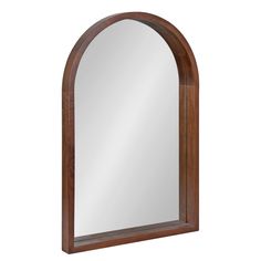 an arched wooden mirror on a white background