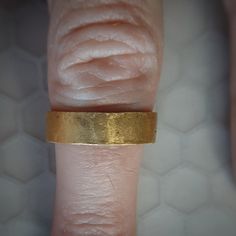 This is a nice thick and substantial solid 24k gold band with a natural hammered finish. The surface texture gives the ring a really cool soft glow. 24k gold is relatively soft, but the thickness and irregular finish makes this ring wearable. This ring is approximately 5.5MM wide. I think that the color of real 24k gold has no match, it is absolutely beautiful. Even if you look for one, there are not many rings available like this. Thanks for checking this ring out! Please look at my customer re Recycled Gold Ring, Many Rings, Handmade Wedding Band, Etsy Gold Ring, Hammered Gold, Recycled Gold, Gold Wedding Band, Handmade Wedding, Gold Band