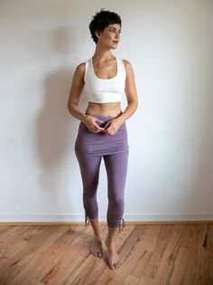 Comfortable, fashionable, breathable leggings to show off your hard work. Made with soft, long-lasting, light, stretchy fabric, these pants are perfect for Yoga and Casual day wear. Can be sold separately or as shown, with a cute matching stretchy mini skirt to accentuate your curves. Paired with Shanti Strappy Yoga Tank Bra in White. Shown here in Amethyst with matching Mini Skirt. Skirt sold together or separately. Handwash or machine wash on Delicate. Hand Dry Fitted Yoga Pants With Elastic Waistband For Workout, Fitted Athleisure Yoga Pants With Elastic Waistband, Fitted Leggings With Elastic Waistband For Pilates, Fitted Leggings With Light Support, Versatile Fitted Leggings With Light Support, Fitted Full-length Bottoms With Light Support, Fitted Yoga Pants With Elastic Waistband For Gym, 4-way Stretch Leggings With Elastic Waistband For Pilates, Tight Yoga Pants With Elastic Waistband For Pilates