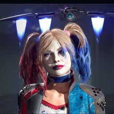 a woman with blue hair and piercings standing in front of two lights, wearing a costume