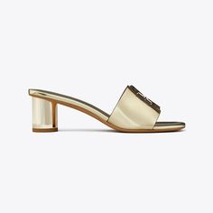 The Ines heeled sandal puts a bold twist on a minimal silhouette, pairing metallic leather upper with a chunky cylindrical heel. A double-stacked logo adds subtle dimension. Heeled Mule, Heeled Mules Sandals, Heeled Sandal, Mule Sandals, Footwear Design Women, Designer Sandals, Heeled Loafers, Metallic Leather, Mule