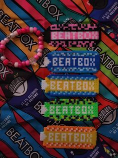 the beaded bracelets are arranged on top of each other in different colors and designs