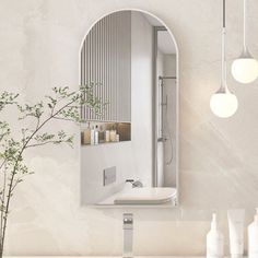 a bathroom with a sink, mirror and vase on the counter next to each other