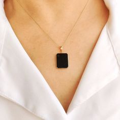 This stunning pendant is set in 14k Solid Yellow Gold with Natural Black Onyx with utmost precision. It is an unique gemstone pendant for nearly every occasion and is completely hassle-free jewelry. 🔷ABOUT GEMSTONE:  Black onyx is often considered a protective stone. It is believed to absorb and transform negative energies, preventing them from affecting the wearer. Black onyx is associated with strength, both physical and emotional. It is believed to provide inner strength, resilience, and sta Black Enamel 14k Gold Necklace, Black 14k Gold Pendant Jewelry, 14k Gold Black Tarnish-resistant Necklace, Black 14k Gold Tarnish Resistant Necklace, Black 14k Gold Tarnish-resistant Necklace, Black Sterling Silver Tarnish Resistant Necklace, Fine Jewelry Black Necklace With Black Enamel, Black Pendant Jewelry For Anniversary, Luxury Black Rectangular Necklace