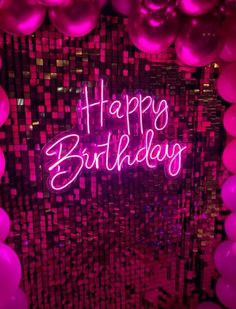 happy birthday neon sign in front of pink balloons and disco ball backdrop with the words happy birthday written on it