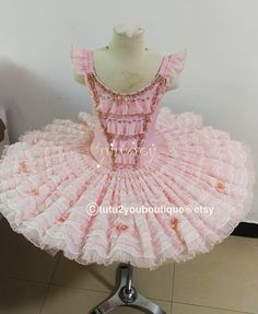 Listed is a pink color tutu that will be professionally made to your measurements. Bodice has 8-panels to couture to your body. The platter has 13 layers for adult size. The tutu is decorated with laces, beads and stones. It is perfect for Aurora, Fairy doll, Paquita and many other classical roles. What is so unique about our tutus is that by working with professional dancers all these years, we have special technique to make the tutu light-weighted, airy, flowy and with great support structure. Pink Fairy Style Tutu Dress With Ruffles, Fairy Style Fitted Tutu Dress With Ruffles, Pink Fitted Balletcore Tutu Dress, Fitted Pink Balletcore Tutu Dress, Pink Tulle Tutu Dress For Dance, Pink Fitted Ballet Tutu Dress, Pink Ballet Tutu Dress, Pink Dance Costumes, Ballet Costumes Tutus