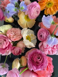 a bunch of flowers that are sitting on a table