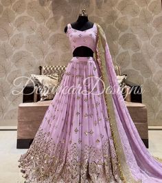 Made to Order/Measurement/Custom Order Lehenga - Color : Lavender - Fabric : Embroidered Georgette with gota work - Fully flared paneled lehenga - Embroidered  Blouse -  Net Dupatta with Gold Border - Drawstring closure with Tassels - - It can be customize in any design or size  PLEASE NOTE: BUYERS ARE RESPONSIBLE FOR ANY CUSTOMS AND IMPORT TAXES THAT MAY APPLY. This is a made to order product. If you opt for 'Made To Measurement Option', we will provide a measurement template and you can share Lavender Salwar Kameez For Wedding Festivities, Lavender Dupatta With Zari Work For Parties, Lavender Party Sharara With Zari Work, Party Lavender Dupatta With Zari Work, Lavender Salwar Kameez For Wedding And Festive Occasions, Lavender Bollywood Sharara For Designer Wear, Festive Lavender Anarkali Set For Wedding, Fitted Lavender Traditional Wear For Diwali, Festive Lavender Traditional Wear For Party