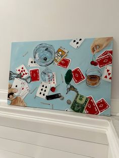 a painting with playing cards and glasses on top of a shelf next to a wall