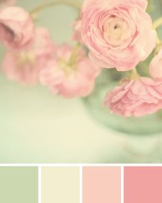 a vase filled with pink flowers on top of a table