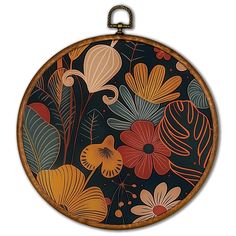 a round wooden frame with flowers and leaves painted on the inside, hanging from a chain