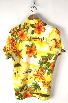 "-Description- >70s Sears men's bright floral island hawaiian shirt >button front >collared >open pocket on the front >very lightweight >size medium/large - not marked with a size so sizing is based off measurements - please check measurements before purchasing >gorgeous hawaiian shirt! >condition: great >color(s): yellow, orange, green, brown >brand: sears >care: hand wash -Measurements- >size: medium/large ✩ all measurements are taken with the item laying fl Yellow Hawaiian Shirt With Camp Collar For Vacation, Printed Yellow Camp Shirt For Beach, Yellow Hawaiian Camp Shirt For Vacation, Printed Yellow Camp Shirt For The Beach, Yellow Printed Camp Shirt For Beach, Yellow Printed Camp Shirt For The Beach, Yellow Printed Camp Shirt For Vacation, Yellow Hawaiian Shirt With Graphic Print For Beach, Yellow Hawaiian Shirt For Vacation