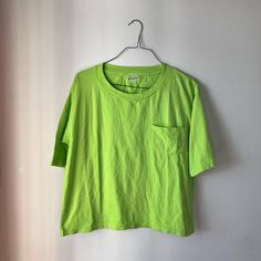 New Without Tags Never Washed Never Worn She Fell Off Of A Rack And Has A Few Slights Dust Marks On Her That Will Wash Off. Size Medium Pocket Tee In Neon Green Has Exterior Logo! *Marked To Prevent Return* Green Pocket T-shirt For Spring, Green Spring T-shirt With Pockets, Green T-shirt With Pockets For Spring, Green Everyday Tops For Summer, Green Everyday Summer Tops, Green Summer Tops For Everyday, Green Tops For Everyday Summer Wear, Green Tops With Pockets, Basic Summer Tops With Pockets