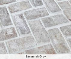 a close up view of a tile floor with the words savannah grey written on it