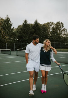 a man and woman walking on a tennis court