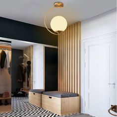 a room with black and white flooring, wooden walls and an open closet door