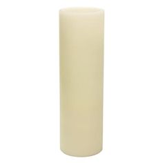 a tall white candle on a white background