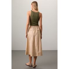 Beige cotton (100% Cotton). Skirt. Pull-on closure. 31.5" from shoulder to hemline. Imported. Spring Cotton Asymmetrical Cargo Skirt, Chic Cotton Cargo Skirt For Spring, Chic Summer Midi Cargo Skirt, Summer Cotton Midi Cargo Skirt, Summer Cotton Cargo Midi Skirt, Chic Cotton Cargo Skirt For Summer, Beige Lined Cargo Skirt For Spring, Beige Cotton Midi Length Skirt, Beige Midi Length Cotton Skirt