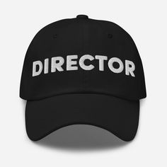 a black baseball cap with the word director printed in white across the front and back