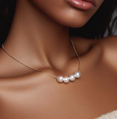 Please Note:  Our processing time is now 1 - 2 weeks before shipping.  We can no longer guarantee delivery by December 24th Our handmade pearl necklace, the epitome of timeless elegance and sophistication, perfect as a gift for a woman celebrating a birthday or as a cherished token for a bridesmaid. This exquisite necklace features lustrous pearls delicately strung together, creating a mesmerizing floating effect that exudes grace and beauty. Each pearl, a symbol of purity and wisdom, is meticul Elegant Silver Necklace For Birthday, Elegant Gold Pearl Necklace For Birthday, Akoya Pearl Necklace With Pearl Pendant For Party, Party Akoya Pearl Necklace In Pearl White, Party Pearl White Akoya Pearl Necklace, Akoya Pearl Pendant Necklace For Party, Pearl White Akoya Pearl Necklace For Parties, Akoya Pearl Necklace In Pearl White For Parties, Akoya Pearl White Pearl Necklace For Parties