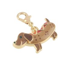 a dog charm is shown with a key chain in the shape of a dachshund