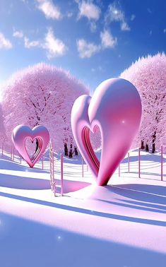 two pink hearts shaped like trees in the snow with blue sky and clouds behind them