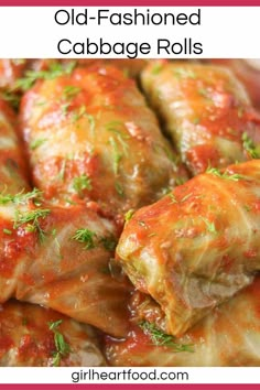 stuffed cabbage rolls with marinara sauce and parsley on top in a white bowl