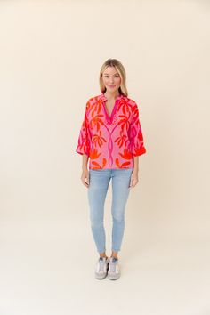 Made from our light and airy cotton voile, and detailed with our signature hand-touched embellishments. Drew is designed with artfully gathered sleeves that give it a relaxed silhouette. Cotton Voile - light and airy Hand Embellished Neckline Runs true to size Beach V-neck Blouse With Vibrant Print, V-neck Kaftan With Vibrant Print For Beach, V-neck Beach Tops With Abstract Print, Tropical V-neck Floral Print Kaftan, Embellished Neckline, Vibrant Print V-neck Tunic, Palm Spring, Gathered Sleeves, Dress Home