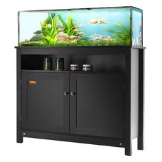 a fish tank sitting on top of a black cabinet