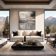 a living room filled with furniture and a large painting hanging on the wall above it