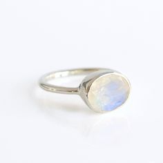 Click ⬆PERSONALIZE IT to see how your ring will look! You'll fall in love with the beautiful color reflecting quality of this Rainbow Moonstone ring. This is a perfectly sized oval to compliment any collection. Popular as a birthday gift for those June babes and moonstone lovers alike. This is a naturally occurring gemstone and no two stones are exactly alike. They may vary in base color from light grey to bright white and vary from opaque to semi-transparent. Natural inclusions allow the light Moon Goddesses, Love And Family, Bridesmaid Rings, Rose Gold Plated Ring, June Birthstone Ring, Ring Moonstone, Rainbow Moonstone Ring, Difficult Times, June Birthstone