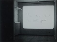 an empty room with writing on the wall