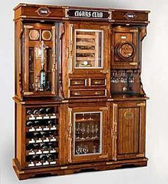 an old fashioned wooden wine cabinet with glass doors