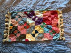 an old quilt is laying on the bed