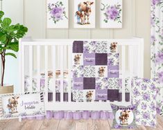 a baby crib bedding set with purple flowers