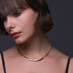 Introducing the stunning Foxy Necklace, the perfect accessory for anyone looking to add a touch of elegance and sophistication to their wardrobe. Made from high-quality 18k gold plated brass, this necklace is both luxurious and durable, ensuring it will last for years to come. With a length of 16 inches and a 1-inch extender, this necklace is adjustable to fit most neck sizes comfortably. Its sleek and shiny design is eye-catching yet subtle, making it the perfect accessory for any occasion, fro Elegant Gold-plated Tarnish-resistant Necklace, Elegant Gold-tone Tarnish Resistant Necklaces, Elegant Gold-tone Tarnish Resistant Necklace, Elegant Gold Tarnish Resistant Necklace, Elegant Tarnish-resistant Chain Necklace For Formal Occasions, Classic Gold Plated Necklace For Everyday Luxury, Chic Formal Snake Chain Necklaces, Chic Formal Necklaces With Snake Chain, Chic Formal Snake Chain Necklace