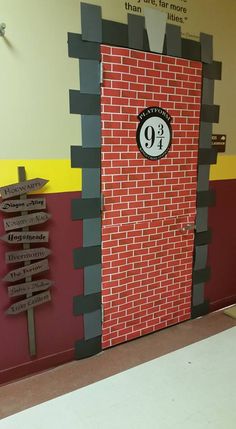 there is a red brick door with the number 9 on it and arrows pointing in different directions