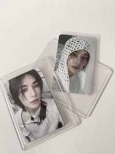 two plastic coasters with pictures of women on them, one is wearing a head scarf