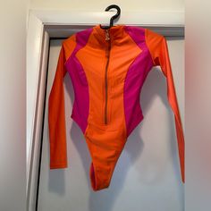 Sports Illustrated/Forever 21 One Piece Swimsuit Nwot Never Worn. Size Small. Long Sleeve, Open Back High Rise. Zipper Front. Swimming Sport, Sports Illustrated, Front Zipper, Sports Women, One Piece Swimsuit, Womens Swim, Pink And Orange, One Piece, Sports