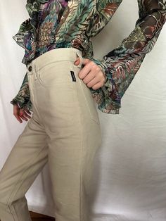 "Vintage high waist beige jeans Istante by Versace. Tight non-stretch denim. Two front pockets. Two pockets on the back. Metal front zipper. Leg is straight. Size 38 tag W.24 L.30, fits like XS Condition 10/10 !NEW with tag! Made in Italy Length- \"/ cm In-Seam- \"/ cm Waist- \"/ cm Hips- \"/ cm 📍 follow the shop on Instagram: @𝚔𝚘𝚛𝚊𝚛𝚎_𝚟𝚒𝚗𝚝𝚊𝚐𝚎 All measurements taken with garment lying flat.  Vintage sizes vary greatly! We recommend comparing measurements with a similar style garment Chic High Waist Beige Flare Jeans, Chic Beige High-waist Flare Jeans, Beige Flare Jeans With Pockets For Spring, Spring Beige Flare Jeans With Pockets, Chic Straight Leg Khaki Jeans, Cream Straight Leg Jeans For Fall, Beige High Waist Flare Jeans For Fall, Chic High Rise Beige Flare Jeans, Beige Flare Jeans With Five Pockets For Spring