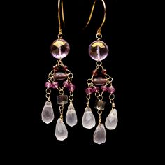 Colorful pink long dangling chandelier earrings made with multiple pink, purple, and reddish-toned gemstones including mystic topaz, garnet, rose quartz, amethyst, crystal, and mystic sapphire. The earrings are wired using nickel-free gold-toned wire and nickel-free French ear wire. The super light-weight design is comfortable to wear and makes a big statement.  I also make this design in Rainbow and Purple. Listings here: https://www.etsy.com/listing/1439337040/rainbow-gemstone-dangling-chandel Fine Jewelry Gemstone Chandelier Dangle Earrings, Amethyst Drop Earrings With Dangling Beads, Dangling Chandelier, Free In French, Rainbow Gemstones, Mystic Topaz, Pink Gemstones, Quartz Rose, Fun Earrings