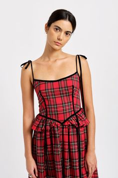 The Tessa dress gets a romantic update this season in classic red plaid. We added black velvet ribbon detailing to this whimsical basque shaped corset dress and a bow at the back so you can cinch it in to fit you perfectly. You'll never wonder where to put your hands, because this one-of-a-kind dress has pockets! - 64% Rayon, 34% Polyester, 2% Elastane - Slips on and has elasticized back with adjustable back and shoulder ties - Lined bodice - Has pockets - Dry clean only or spot clean - Made in Alternative Wedding Dress, Black Velvet Ribbon, Mom Fall, Alternative Wedding Dresses, Holiday Party Outfit, Plaid Fabric, Gathered Skirt, Mid Dresses, Velvet Ribbon