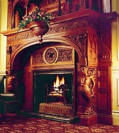 an ornate fireplace in the corner of a room