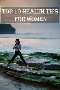 a woman is doing yoga on the rocks by the water at sunset or sunrise with an island in the background