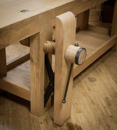 a wooden table with a pair of scissors on it and a piece of wood in the middle