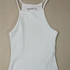 Bnwt Abercrombie & Fitch Bodysuit. Size Xs White Bodysuit Tank Top White Fitted Tank Bodysuit, White Stretch Racerback Bodysuit, Fitted White Tank Bodysuit, White Racerback Bodysuit For Summer, Casual White Ribbed Bodysuit, White Ribbed Fitted Bodysuit, White Fitted Ribbed Bodysuit, Fitted White Ribbed Bodysuit, Black Bodysuit Longsleeve