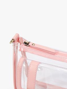 Elevate your event style with our Lila's Clear Crossbody Bag. This chic accessory complies with the clear bag policy. You can pass through security checks quickly and easily at any sporting events, concerts, festivals or any other outdoor activities. Made of premium PVC and vegan leather Gold-colored hardware, waterproof and durable, easy to clean. A transparent and spacious interior makes it easier to access your essentials An adjustable embroidery-patterned strap can be used as a shoulder bag Clear Zipper Closure Pouch Bag, Pink Shoulder Bag With Clear Strap, Everyday Portable Clear Bag, Portable Clear Bag For Everyday Use, Portable Clear Bags For Everyday Use, Pink Bag With Clear Strap For Everyday Use, Clear Bags With Transparent Straps For Everyday Use, Clear Rectangular Bag With Zipper Closure, Pink Everyday Bag With Clear Strap