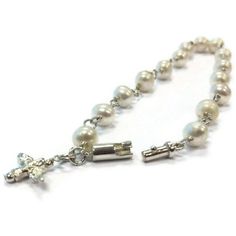 This pearl bracelet created by Jewelry By Carmal is made of: white freshwater pearls, sterling silver: dove charm, spring ring clasp and findings. This bracelet measures 7 1/2 inches in length. View more beaded bracelets: http://www.etsy.com/shop/jewelrybycarmal?section_id=8002918 Pearl is the birthstone for June and the gemstone for the 3rd and 30th Wedding Anniversaries. All of our jewelry arrives wrapped and ready for gift giving! We offer free standard shipping (via USPS) within the United S Silver Pearl Bracelets With 8mm Beads, Wedding Rosary Bracelet With Pearl Charm, Formal White Pearl Bracelet In Sterling Silver, Formal White Sterling Silver Pearl Bracelet, Elegant Pearl Bracelet For First Communion, Elegant Pearl Rosary Bracelet For Baptism, Elegant Silver Pearl Bracelet For Baptism, Wedding White Gold Pearl Bracelet With Pearl Drop, White Gold Pearl Drop Wedding Bracelet